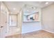 Inviting condo entryway featuring wood flooring, coat closet and a view to the kitchen at 1550 Spinnaker Dr. # 3123, North Myrtle Beach, SC 29582