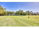 Condo building overlooking the community golf course and green, surrounded by mature trees at 1550 Spinnaker Dr. # 3123, North Myrtle Beach, SC 29582