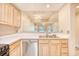 Kitchen featuring wood cabinets and stainless steel appliances with a view to the living area at 1550 Spinnaker Dr. # 3123, North Myrtle Beach, SC 29582