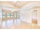 Spacious living room with wood floors, neutral paint, and large windows for natural light at 1550 Spinnaker Dr. # 3123, North Myrtle Beach, SC 29582
