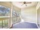 Relaxing screened porch with ceiling fan and view of the community's manicured landscape at 1550 Spinnaker Dr. # 3123, North Myrtle Beach, SC 29582