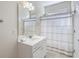 Practical bathroom with a single sink vanity, shower and tub combination with a shower curtain at 1613 Havens Dr., North Myrtle Beach, SC 29582