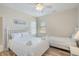 Comfortable bedroom with one queen and one twin bed with white bedding at 1613 Havens Dr., North Myrtle Beach, SC 29582