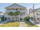 Two-story home with double balconies and parking underneath, close to the beach at 1613 Havens Dr., North Myrtle Beach, SC 29582