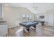 Spacious game room with two pool tables, light walls, and a ceiling fan at 1613 Havens Dr., North Myrtle Beach, SC 29582