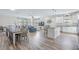 Open-concept living space featuring wood floors, dining area and ample seating at 1613 Havens Dr., North Myrtle Beach, SC 29582