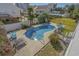 Backyard pool with lounge chairs for relaxing by the water and landscaped yard at 1613 Havens Dr., North Myrtle Beach, SC 29582