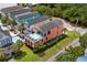 Bright coral beach house with private pool and multiple balconies overlooking lush tropical landscaping at 1617 N Dogwood Dr. N, Surfside Beach, SC 29575