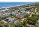 Coastal community featuring houses with colorful exteriors, surrounded by lush greenery at 1617 N Dogwood Dr. N, Surfside Beach, SC 29575