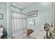 Bathroom featuring a shower with curtain, and a vanity sink, offering a clean and functional space at 1617 N Dogwood Dr. N, Surfside Beach, SC 29575