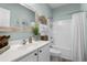 Well-lit bathroom with a sink, storage, and shower/tub combination at 1617 N Dogwood Dr. N, Surfside Beach, SC 29575