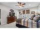 Comfortable bedroom with neutral color scheme, ceiling fan, and wooden dresser with mounted tv at 1617 N Dogwood Dr. N, Surfside Beach, SC 29575