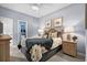 Bedroom featuring a comfortable bed, nautical decor, and adjoining bathroom at 1617 N Dogwood Dr. N, Surfside Beach, SC 29575