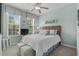 Comfortable bedroom featuring coastal decor, ceiling fan, and plush seating at 1617 N Dogwood Dr. N, Surfside Beach, SC 29575