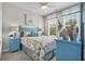 Coastal bedroom with stylish starfish bedding, nautical decor, and ample natural light at 1617 N Dogwood Dr. N, Surfside Beach, SC 29575