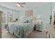 Comfortable bedroom with a full bed, ceiling fan, and natural light from the window at 1617 N Dogwood Dr. N, Surfside Beach, SC 29575