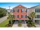 Beautiful two-story home with tropical landscaping and ample space underneath at 1617 N Dogwood Dr. N, Surfside Beach, SC 29575
