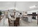 Open-concept living area with a dining table, kitchen bar, and spacious living room at 1617 N Dogwood Dr. N, Surfside Beach, SC 29575