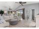 Bright living room with vaulted ceilings, comfortable seating, ceiling fan, and access to the outdoor balcony at 1617 N Dogwood Dr. N, Surfside Beach, SC 29575
