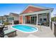 Private pool and cozy, covered porch with outdoor furniture for ultimate relaxation at 1617 N Dogwood Dr. N, Surfside Beach, SC 29575