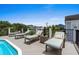 Inviting pool deck features cushioned lounge chairs for relaxing and enjoying the outdoors at 1617 N Dogwood Dr. N, Surfside Beach, SC 29575