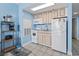 Compact kitchen with appliances, granite countertops, and light-colored cabinetry at 1708 N Ocean Blvd. # 101, Myrtle Beach, SC 29577