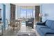 Living room with ocean view, poolside, with comfortable seating and dining area at 1708 N Ocean Blvd. # 101, Myrtle Beach, SC 29577
