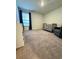 Bedroom with a crib, a window with dark curtains, and a gray chair at 1709 Perthshire Loop, Myrtle Beach, SC 29579
