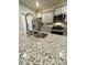 Close-up of granite kitchen island featuring a stainless steel sink and modern faucet at 1709 Perthshire Loop, Myrtle Beach, SC 29579