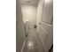 Compact laundry room showcasing a white washer and dryer set with neutral walls and tile floors at 1709 Perthshire Loop, Myrtle Beach, SC 29579