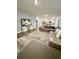 Inviting living room featuring a large sofa, decorative rug, and a TV above a stylish console at 1709 Perthshire Loop, Myrtle Beach, SC 29579