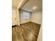 Entryway shot featuring durable hardwood floors, neutral walls, and a view into the living room at 1709 Perthshire Loop, Myrtle Beach, SC 29579