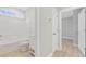 Bathroom featuring shower and tub combo with white cabinets and a large framed mirror with lots of light at 1727 Cane Branch Rd., Loris, SC 29569