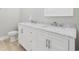 Elegant bathroom with double marble vanity and white cabinets at 1727 Cane Branch Rd., Loris, SC 29569