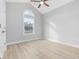 Bedroom featuring vaulted ceilings, ceiling fan and large window overlooking the front yard allowing for natural light at 1727 Cane Branch Rd., Loris, SC 29569
