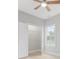 Bedroom features an open closet, a ceiling fan, and light hardwood floors at 1727 Cane Branch Rd., Loris, SC 29569