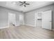 Spacious bedroom featuring tray ceiling, ceiling fan, and ensuite bath at 1727 Cane Branch Rd., Loris, SC 29569
