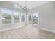 Dining area featuring large windows and a glass door, overlooking the yard and letting in lots of light at 1727 Cane Branch Rd., Loris, SC 29569
