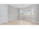 Dining area featuring a modern chandelier and large windows overlooking the yard and letting in lots of light at 1727 Cane Branch Rd., Loris, SC 29569