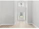 Bright foyer boasts soaring ceilings, modern lighting, and beautiful flooring at 1727 Cane Branch Rd., Loris, SC 29569