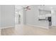 Open-concept living room and kitchen with modern lighting and lots of space at 1727 Cane Branch Rd., Loris, SC 29569