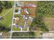 Expansive aerial view showcases a spacious lot in a serene, wooded neighborhood at 1900 Blue Bird Rd., Loris, SC 29569