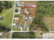 Expansive aerial view showcases a spacious lot in a serene, wooded neighborhood at 1900 Blue Bird Rd., Loris, SC 29569