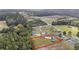 Aerial view featuring home on a vast, well-maintained lot surrounded by lush greenery at 1900 Blue Bird Rd., Loris, SC 29569