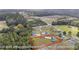 Aerial view featuring home on a vast, well-maintained lot surrounded by lush greenery at 1900 Blue Bird Rd., Loris, SC 29569