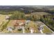 Aerial view of a home with a spacious lot, in a community surrounded by mature trees at 1900 Blue Bird Rd., Loris, SC 29569