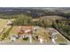 Aerial view of a home with a spacious lot, in a community surrounded by mature trees at 1900 Blue Bird Rd., Loris, SC 29569