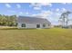 Large backyard view featuring a grassy lawn at 1900 Blue Bird Rd., Loris, SC 29569