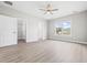 Airy bedroom with closet, ceiling fan, and a window offering neighborhood views at 1900 Blue Bird Rd., Loris, SC 29569