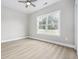Well-lit bedroom with a ceiling fan and a large window with natural light at 1900 Blue Bird Rd., Loris, SC 29569